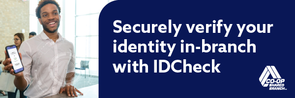 Image of guy who is wearing a white shirt showing his phone screen while smiling. Large white text on a dark blue background says 'Securely verify your identity in-branch with IDCheck' with the white CO-OP Shared Branch logo in bottom right corner